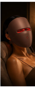 Woman relaxing while wearing the Luxera LED mask in the evening