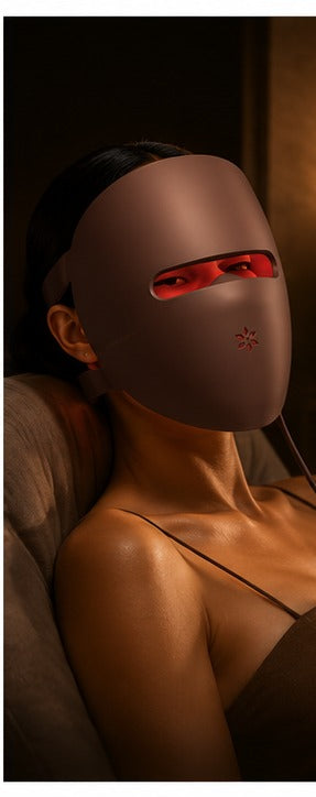 Woman relaxing while wearing the Luxera LED mask in the evening